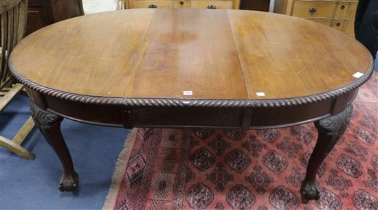 A 1920s mahogany ball and claw extending dining table W.180cm